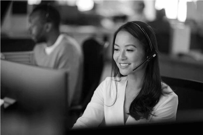 Call center operator wearing headset in grayscale